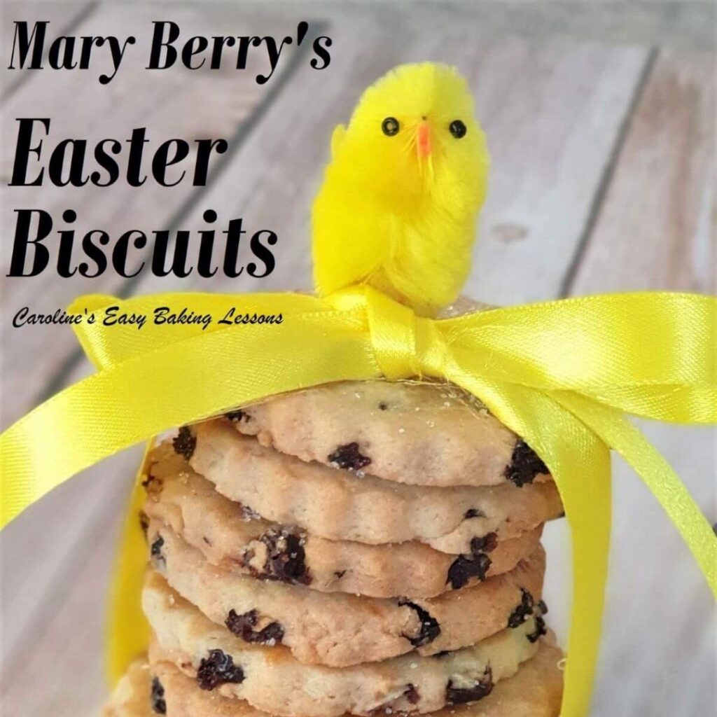 Close shot of stacked biscuits tied with yellow ribbon, little chick on top and text 'Mary Barry's Easter biscuits review'.