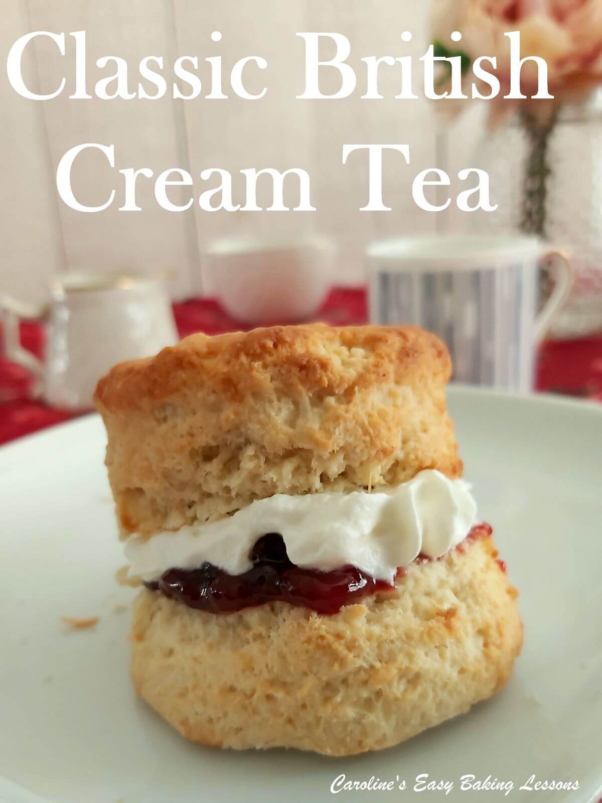 British scone with a big rise, split in half with jam and cream and tea cup behind and cream tea title.