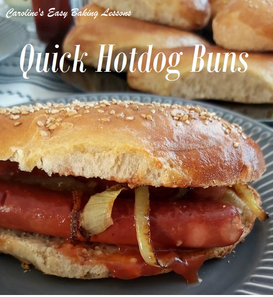 Quicker hot dog bun up close, with hotdog sausages, onin and ketchup.