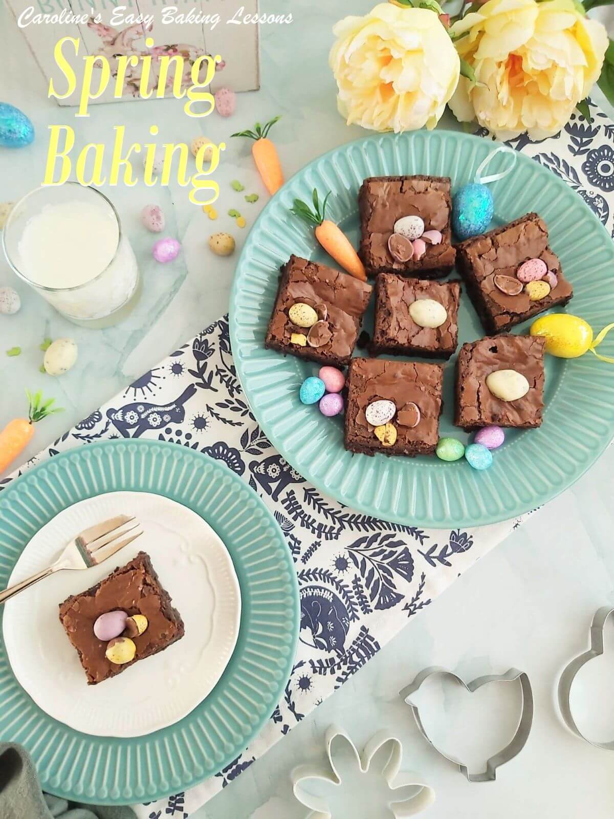 Overhead shot of mini egg topped brownies on a blue plate, on a SPring themed table, with one slice served & titled Spring Baking.