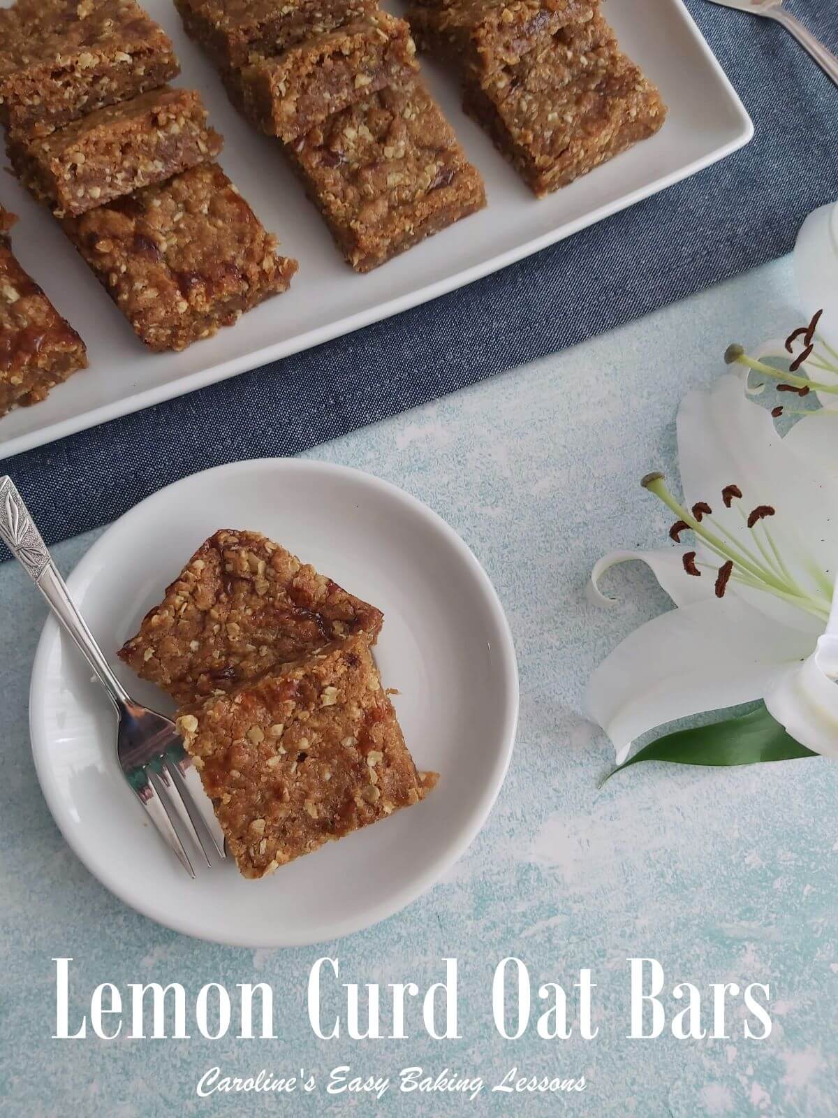 Lemon curd oat bars on a latter and 2 on a small plate served with the title.
