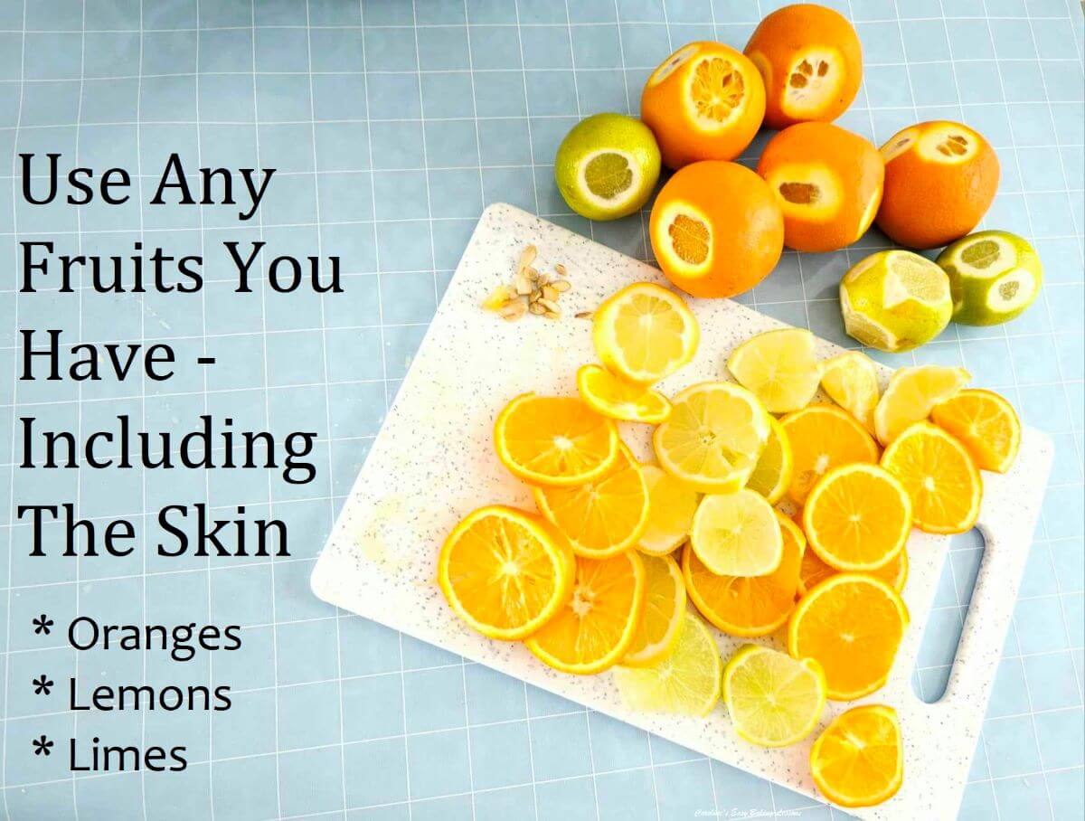 overhead shot of a chopping board with orange, leon and lime slices, stones and some fruit to the back with text.