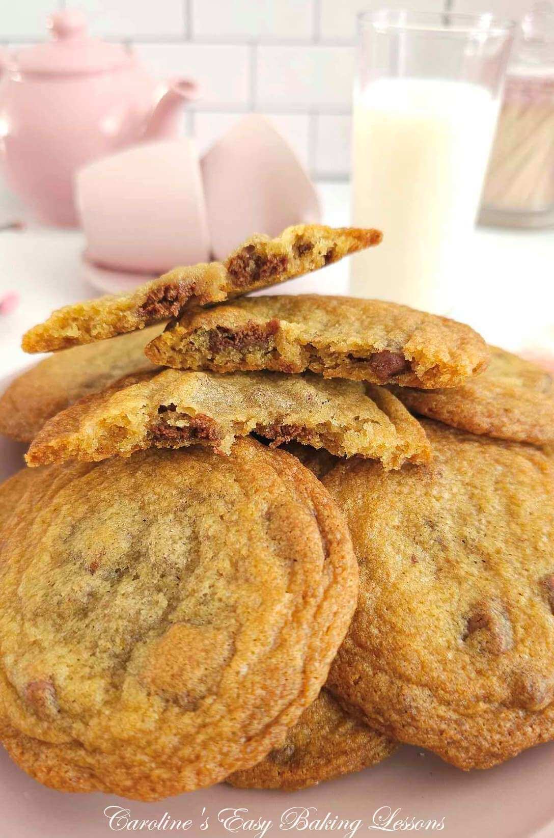 Extra close shot of a stack of chocolate chip cookies with 3 haves stacke don top, showing the chocolate and texture.