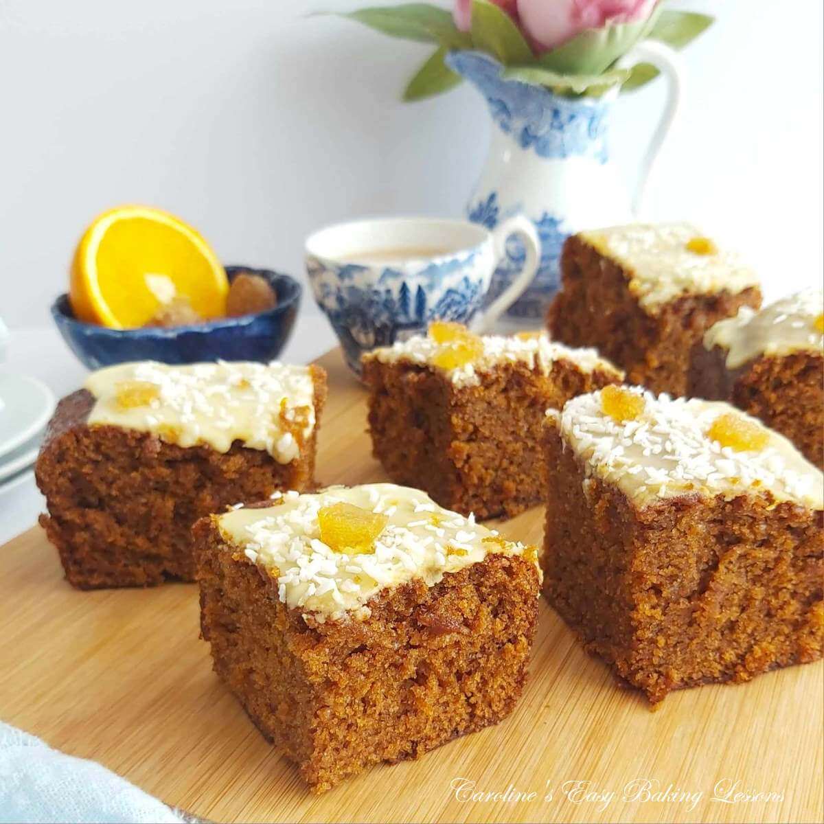 Front angled photo of glazed gingerbread cake squares.