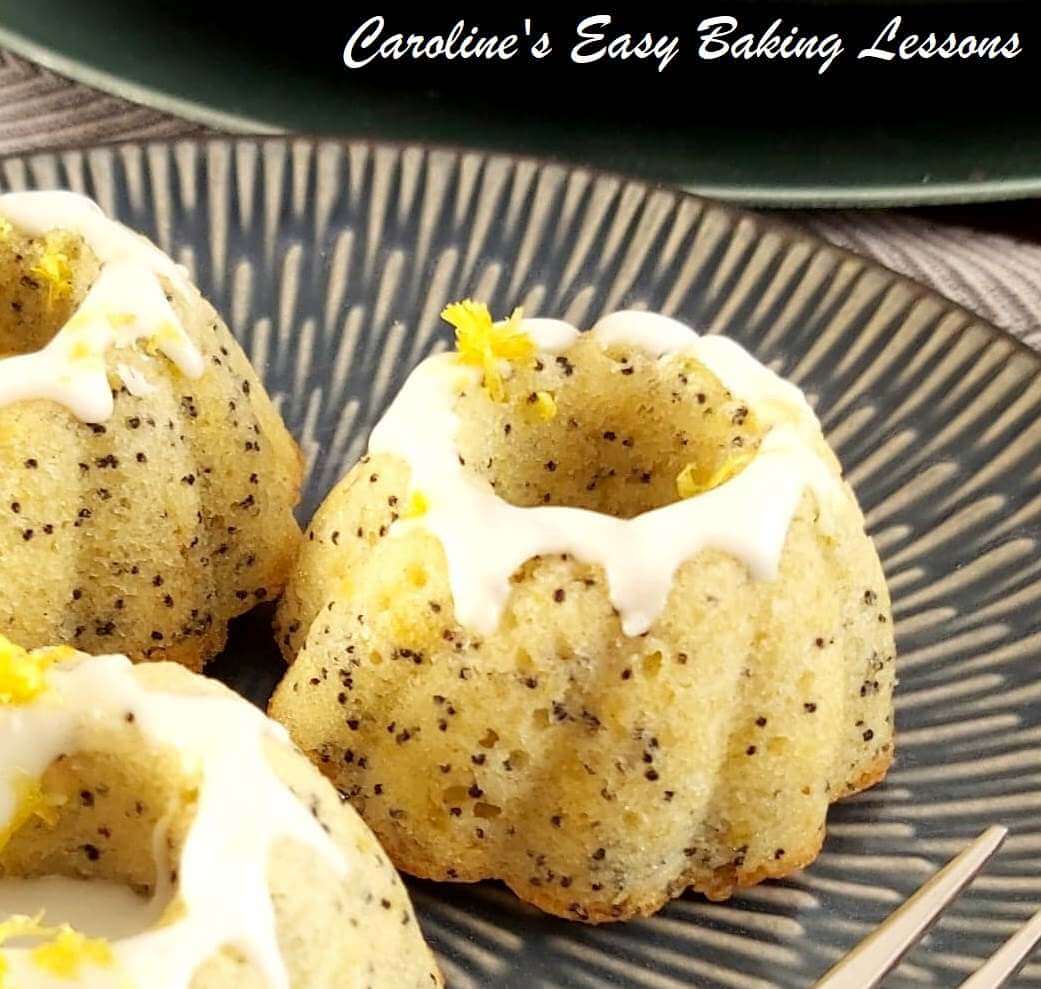 Extra close shot of some mini lemon poppy seed bundt cakes, with glazing.