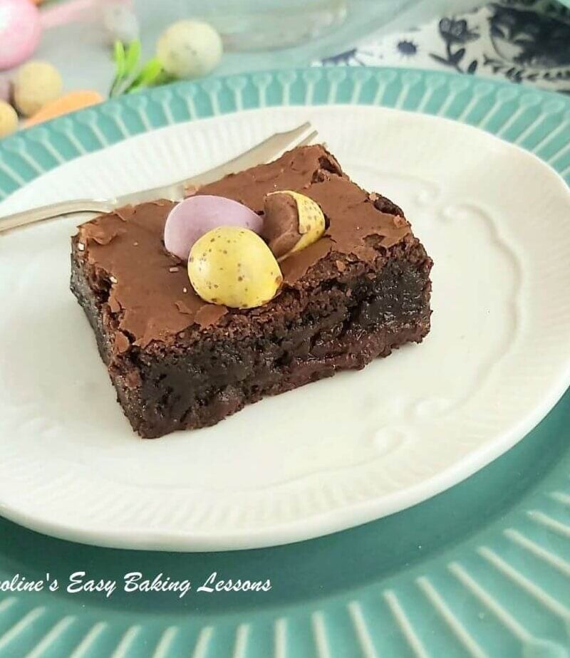 Close and angled shot showing a slice of brownie and it's gooey texture