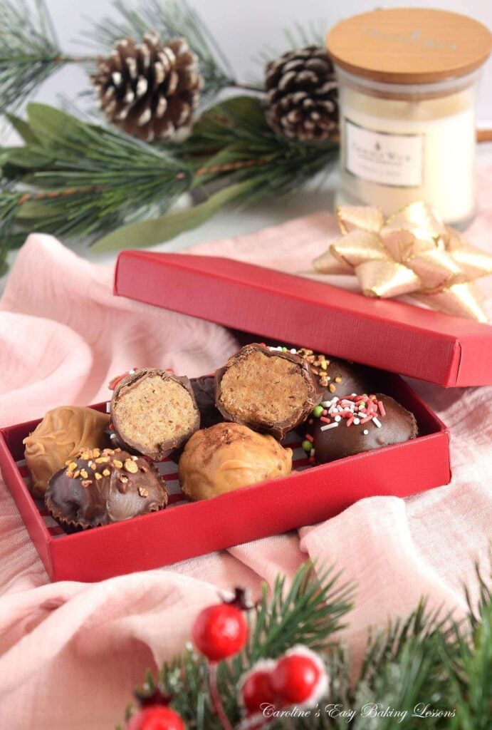 Close shot of red box of chocolate and candy melt coated chai truffles.