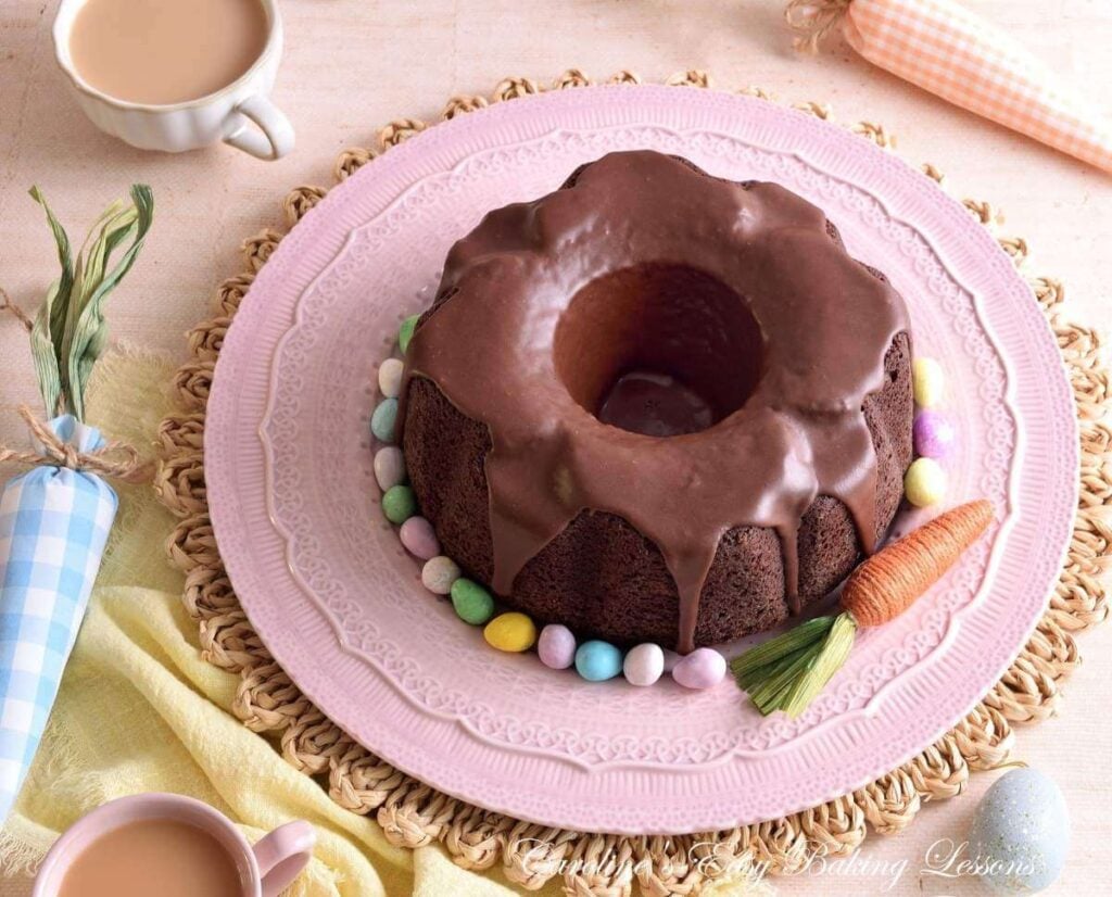 Overhead image of pastel Easter decorated table with Devil's Food chocolate bundt cake and mini eggs.