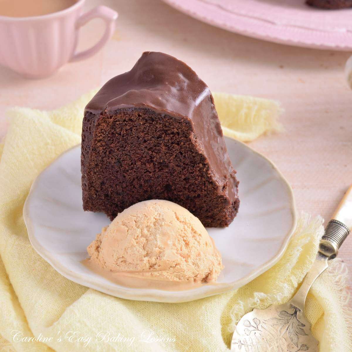 Close shot of a slice of Devil's Food chocolate bundt cake, served with icrecream.