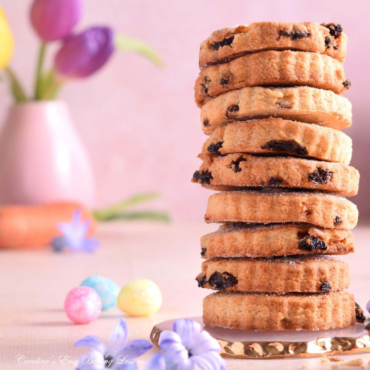 Close pastel Spring image of stack of Mary Berry Easter biscuits/cookies.