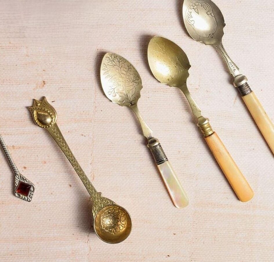 Zoomed in overhead shot of some vintage old spoons.