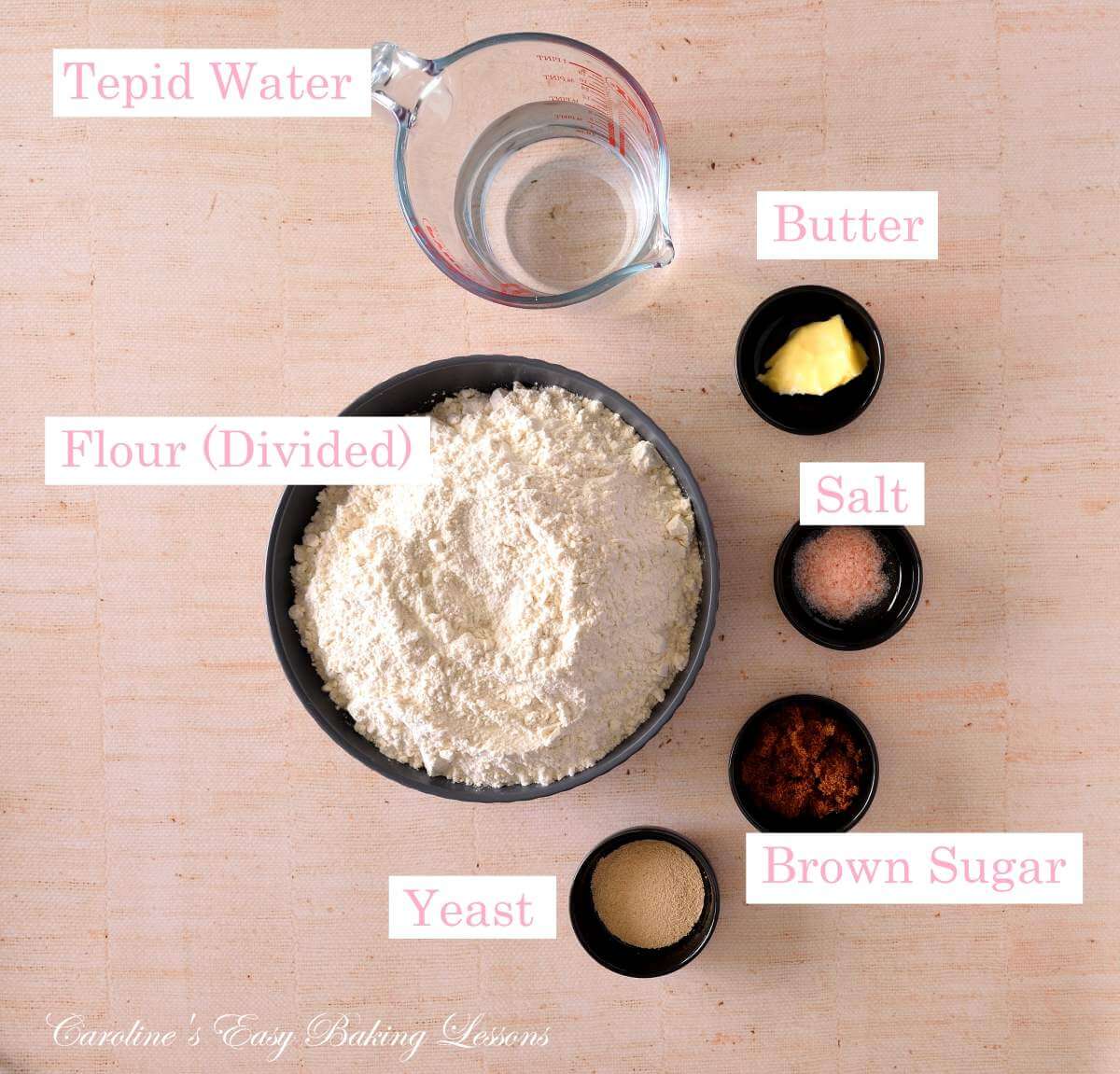 Overhead image of labelled bowls of ingredients for pretzel dough.