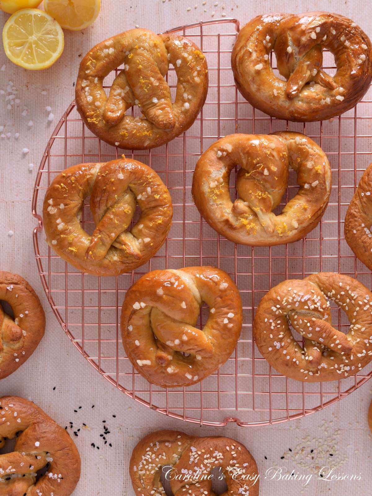 Overhead image of homemade sweet and savoury yeast pretzels on cooling rack.